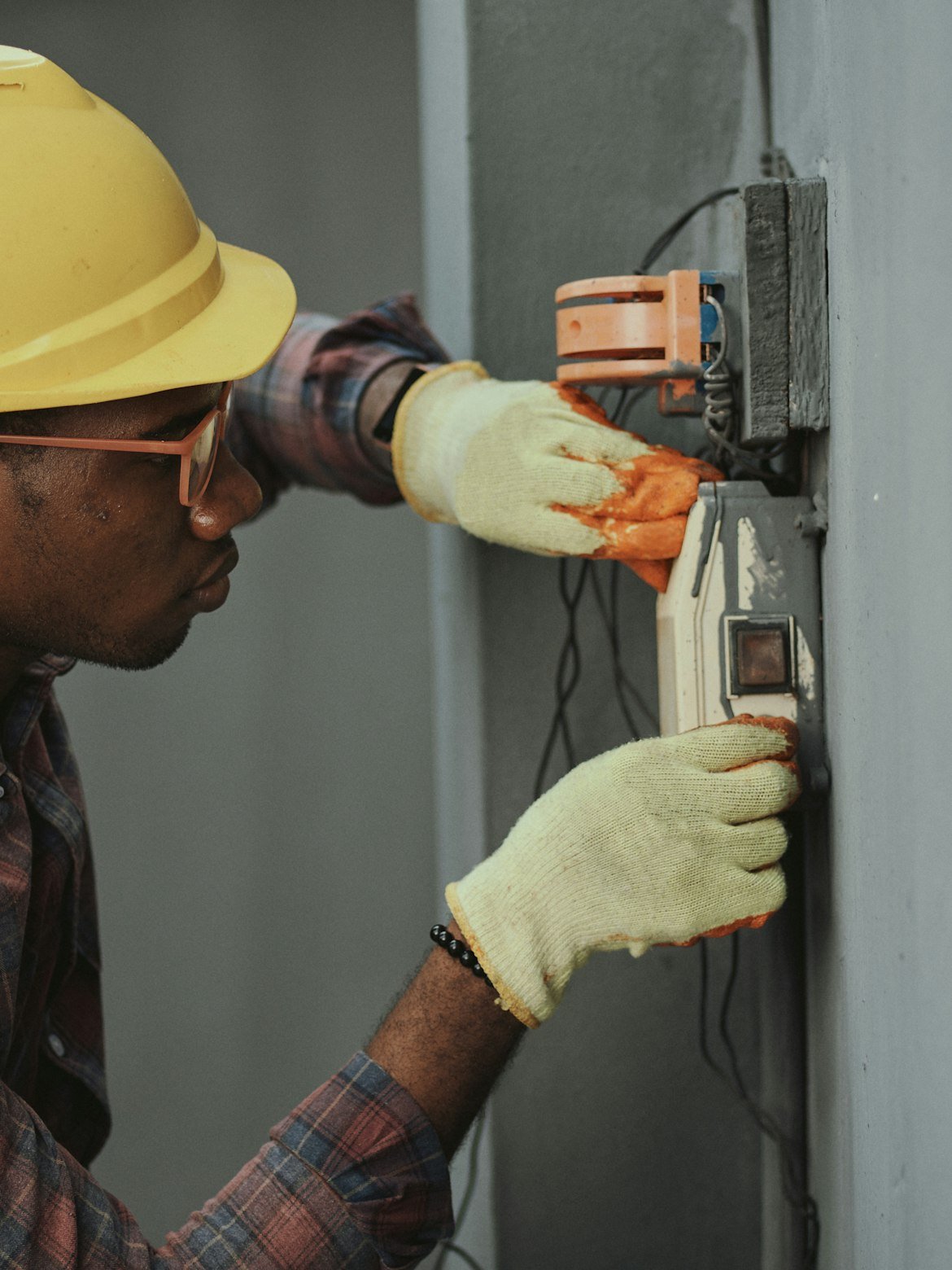 An Okanagan electrician wiring a panel on the job