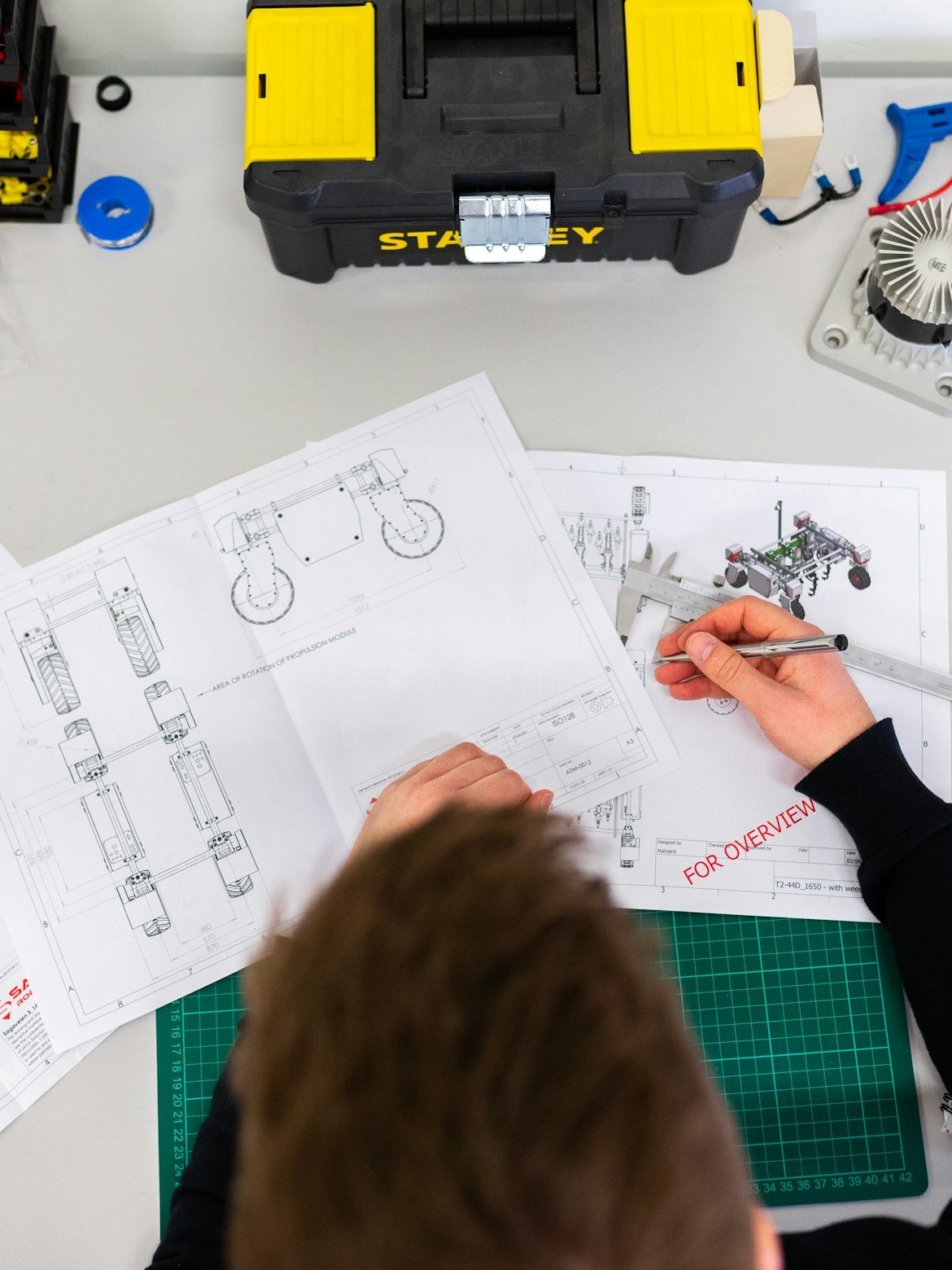 Tools and project blueprints on the Dam AI desk